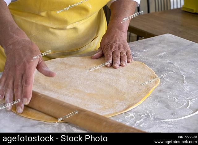 Woman rolling pasta dough, Trattoria Logge Vasari, Piazza Grande, Arezzo, Tuscany, Italy, Europe