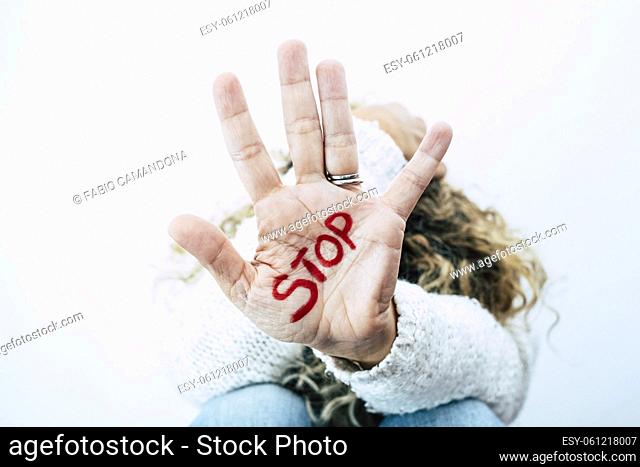 Women's day concept and stop abuse violence on females people - closeup of hand with sotp written on - sexual assault and fight in domestic life - man against...