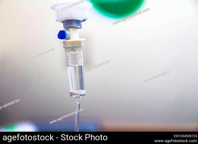 Set IV fluid intravenous drop saline drip in a hospital room. Close up, selective focus and copy space