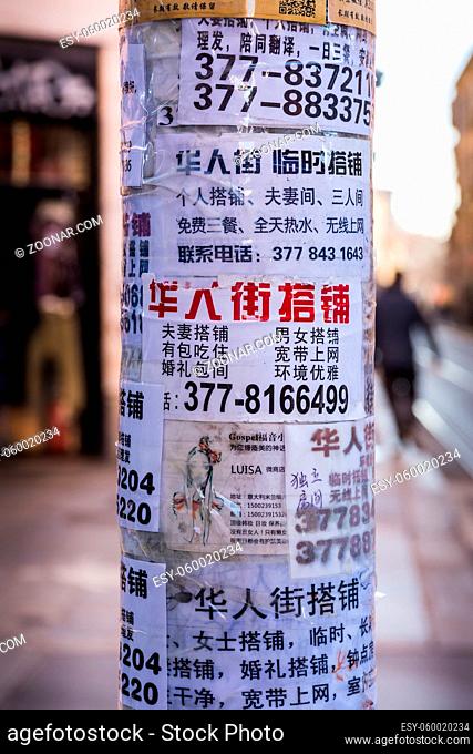 Chinese Letters on Random Papers Taped to Pole in Milan Italy Chinatown Winter 2016