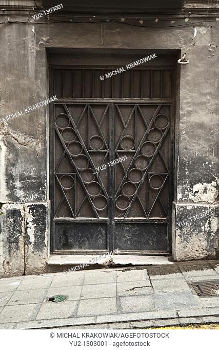 Ornate door of old townhouse in Granada, Spain