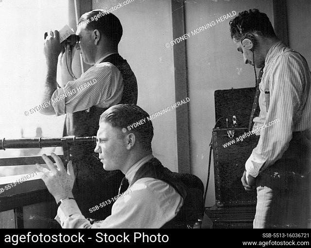Harry Solomons (standing, left) at work in a makeshift commentary box. April 1, 1940