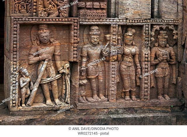 Statues carved on wall in heritage Buddhist excavated site , Udayagiri , Orissa , India