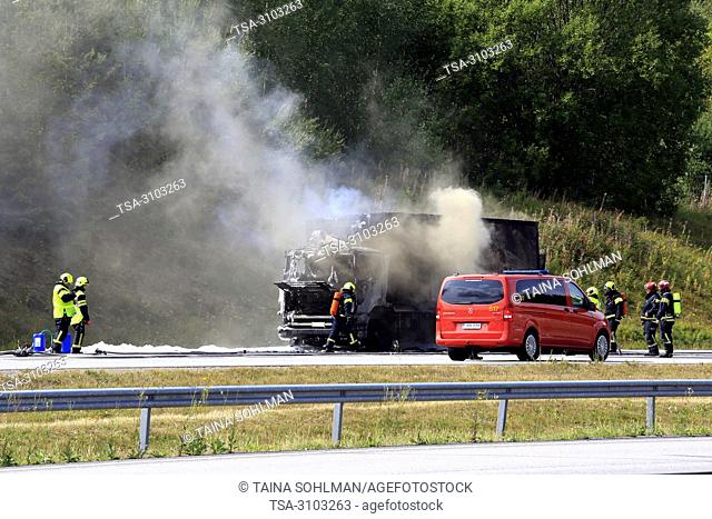 SALO, FINLAND - AUGUST 17, 2018: Firefighters extinguish vehicle fire on E18 in Salo. Delivery truck is completely destroyed in fire