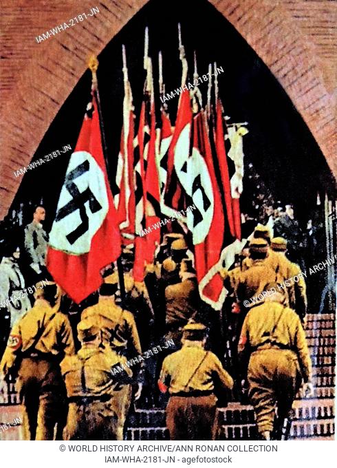 Nazi swastika flags are carried into a German Church circa 1933-36