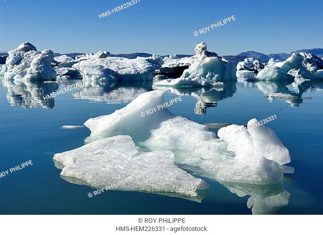 Greenland, Angmassalik Region, Tiniteqlaaq, Melting of an Iceberg get stranded at the Sermilik Fjord