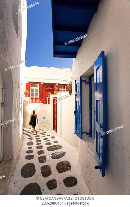 Woman in the alleys of town center, Mykonos, Cyclades Islands, Greek Islands, Greece, Europe