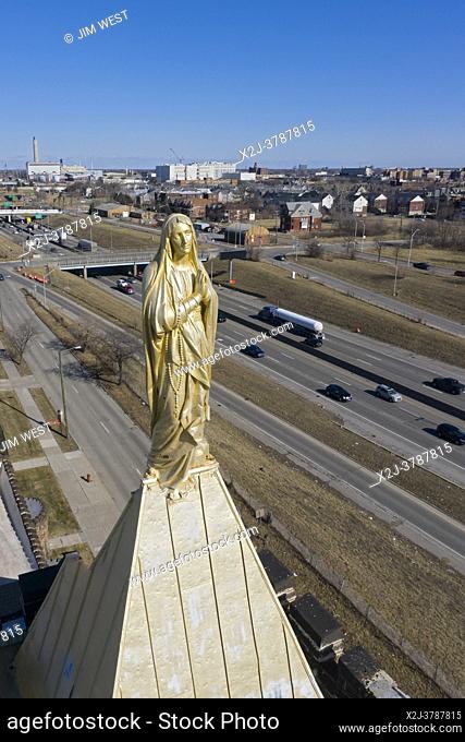 Detroit, Michigan - A statue of Mary above Interstate 94 on the steeple of Our Lady of the Rosary Catholic church