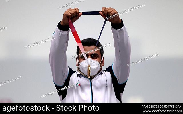 24 July 2021, Japan, Tokio: Shooting: Olympics, final, air pistol 10 m, men, in the Asaka Shooting Range. Javad Foroughi from Iran cheers about gold