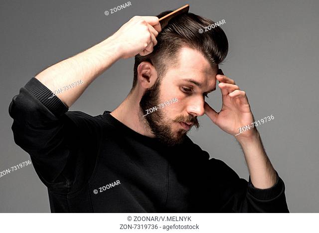 young man comb his hair