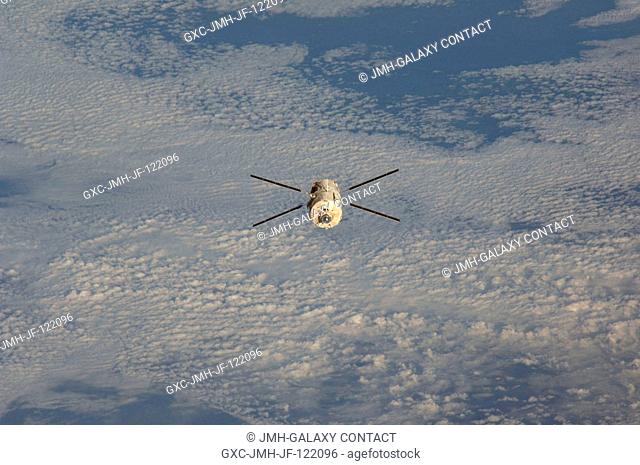 Backdropped by a blanket of clouds, European Space Agency's (ESA) Jules Verne Automated Transfer Vehicle (ATV) continues its relative separation from the...