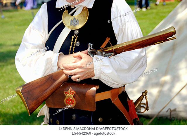 Early peiord miltia man in costume and gun Circa 1700 reenactment of the Colonial period lifestyle in Southeastern Michigan at the Feaste of Sainte Claire Port...