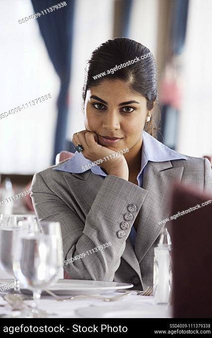 Businesswoman smiling for the camera in restaurant