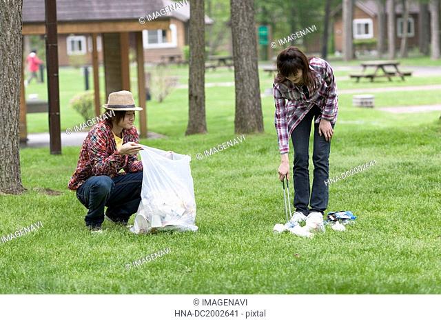 Couple Picking Up Litter