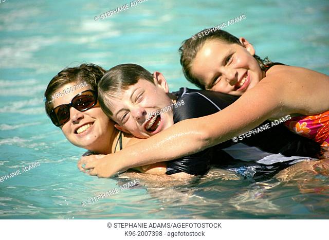 Family together in pool
