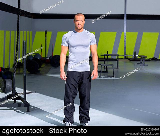 Fitness man at crossfit gym standing