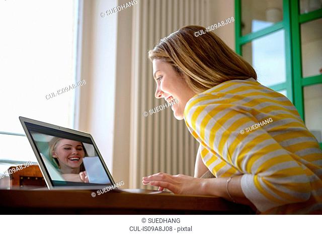 Young woman on video call with friend