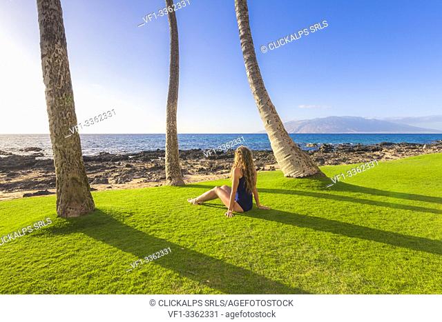 A girl enjoing the sun in Maui, near Makena beach, Maui island, Hawaii, USA