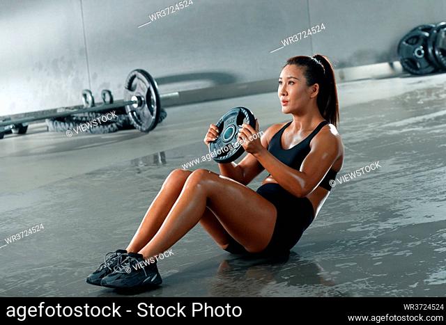 Young women in the gym training