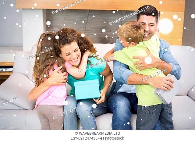 Young siblings giving presents to their parents
