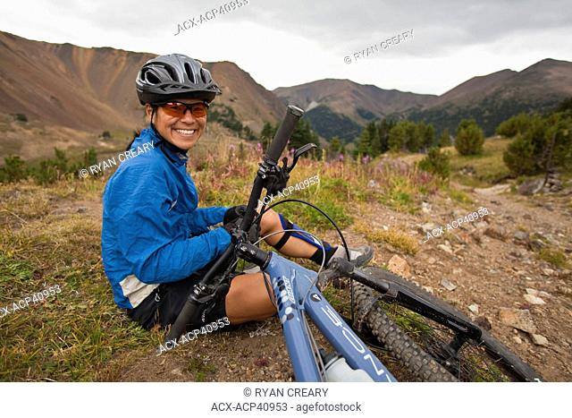 A female mountain biker enjoying the perfect singletrack trails of Spruce Lake Protected Area, Southern Chilcotins, British Columbia, Canada