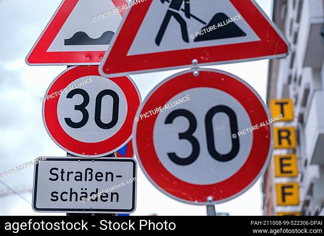 PRODUCTION - 06 October 2021, Lower Saxony, Hanover: Speed limit 30 signs stand in a street. After a long dispute between the federal government and the states