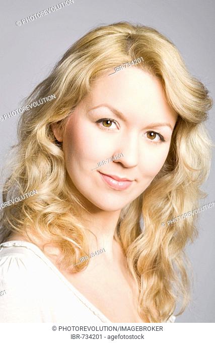 Portrait of a smiling young blonde woman