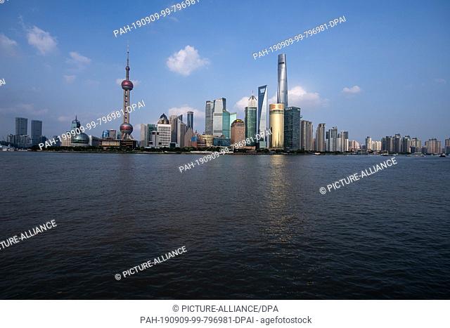08 September 2019, China, Shanghai: View from the promenade ""The Bund"" at the Huangpu river to the skyline of the special economic zone Pudong with its...