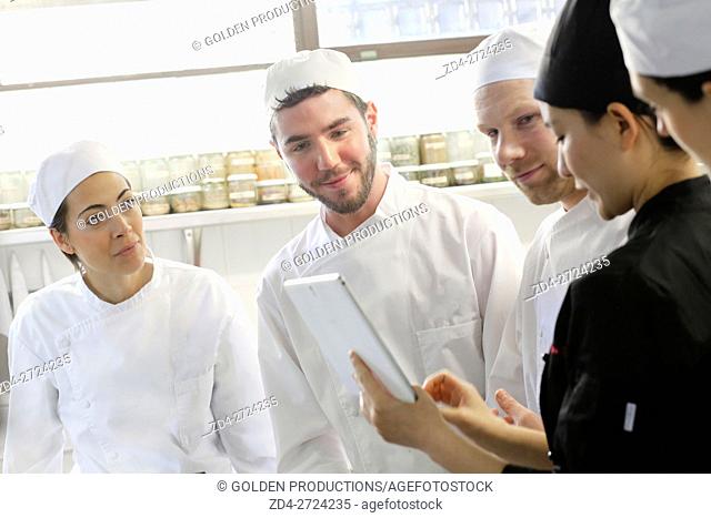 Chefs preparing menu in restaurant kitchen
