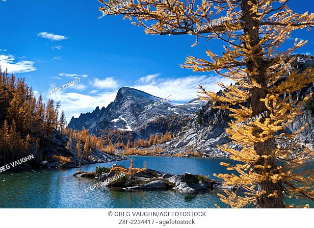 Perfection Lake and Little Annapurna mountain with alpine larch trees showing autumn color in The Enchantments, Alpine Lakes Wilderness, Washington