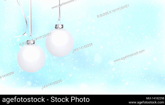 White Christmas balls in front of a pastel-colored blue background