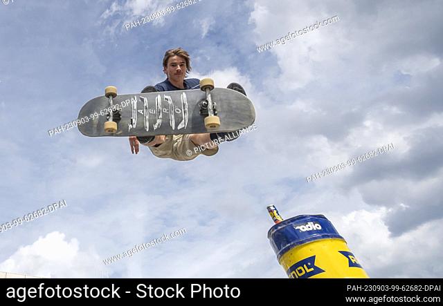 03 September 2023, Saxony, Dresden: Fabi Thies during a training jump during the 26th East German Skateboard Championship