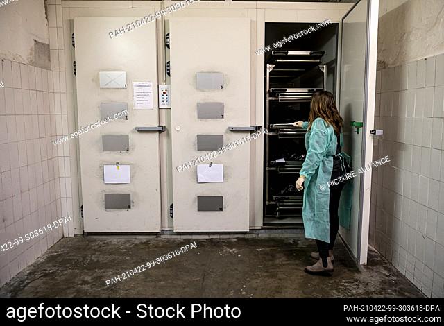 PRODUCTION - 30 January 2021, Berlin: Janika Kreutzer, make-up artist, opens the door of refrigeration in the morgue. The 23-year-old make-up artist helps...