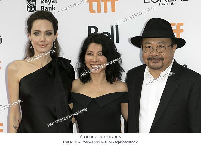 Angelina Jolie (l-r), Loung Ung and Rithy Panh attend the premiere of 'First They Killed My Father' during the 42nd Toronto International Film Festival, tiff