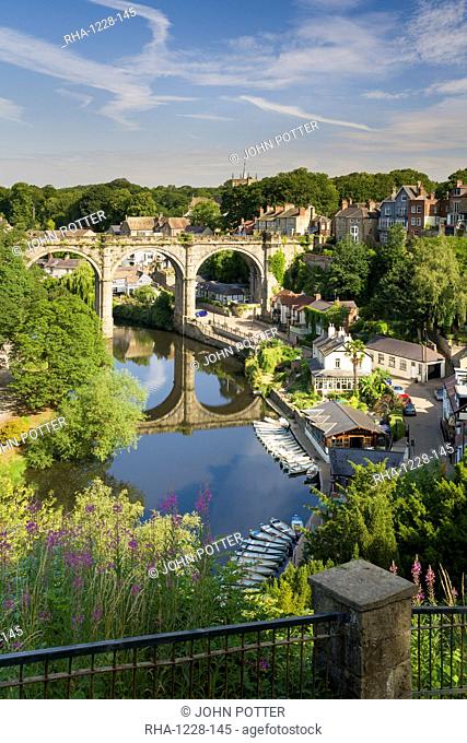 Rowing boats and viaduct over the River Nidd in lower Nidderdale on a mid-summer sunny day, Knaresborough, Borough of Harrogate, North Yorkshire, England