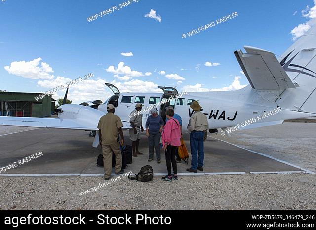 Tourists boarding a Wilderness Air Namibia Cessna at the Hosea Kutako International Airport, the main international airport of Namibia