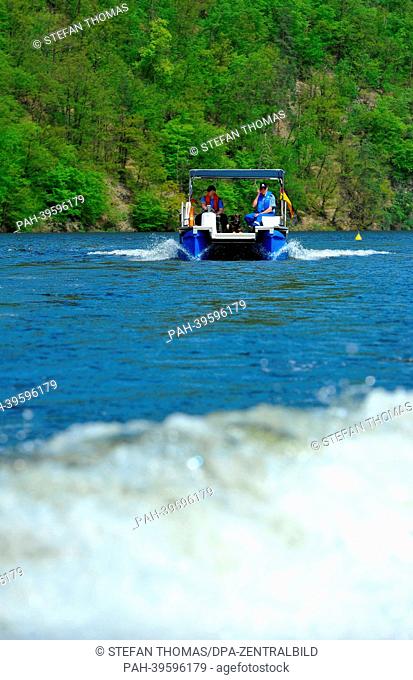 Canine officer Karlheinz Floeter (R) from the Suhl Police Department sail across the Hohenwarte Reservoir with sniffer dog Aik on a water police boat in...
