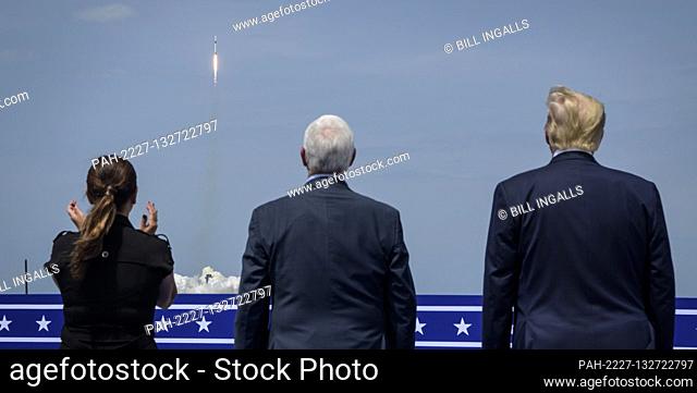 In this photo released by the National Aeronautics and Space Administration (NASA), President Donald Trump, right, Vice President Mike Pence