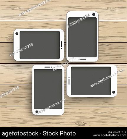 4 smartphones on the wooden background. Eps 10 vector file