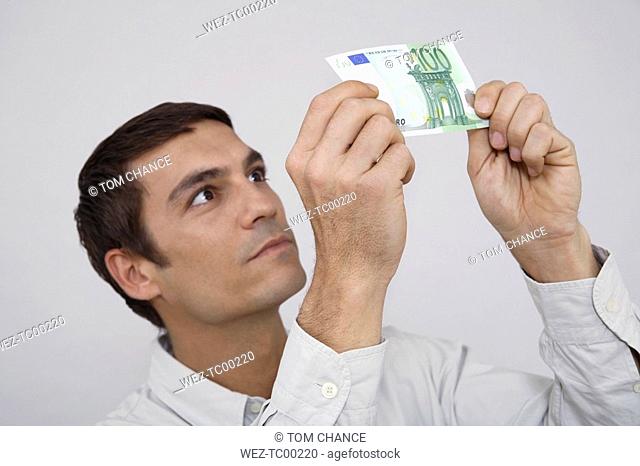 Man holding euro note, close-u