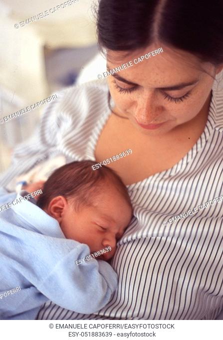 portrait of mom and her newborn male child vintage photography on film