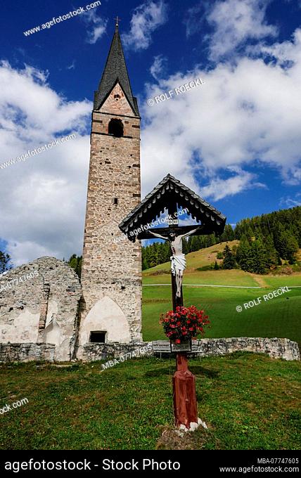 Crucifix, church foundation walls and old bell tower of Wengen, Weiler Tolpei, La Val, Gader valley, South Tirol