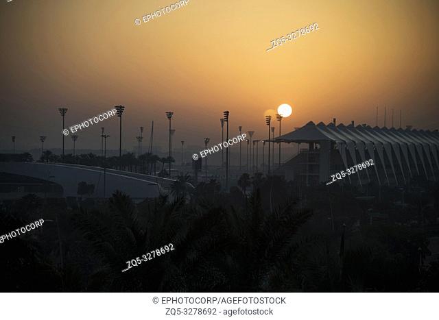 Setting Sun with YAS Marina Circuit partly seen, Dubai, United Arab Emirates