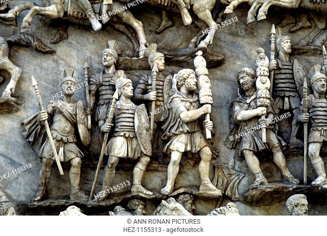 Roman soldiers taking part in decursio - ritual circling of funeral pyre, c180-196. Detail of a relief from the Antonine Column, Rome
