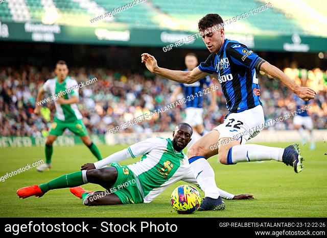 Seville, Spain. 23rd, December 2022. Matteo Ruggeri (22) of Atalanta and Youssouf Sabaly (23) of Real Betis seen during the football friendly between Real Betis...