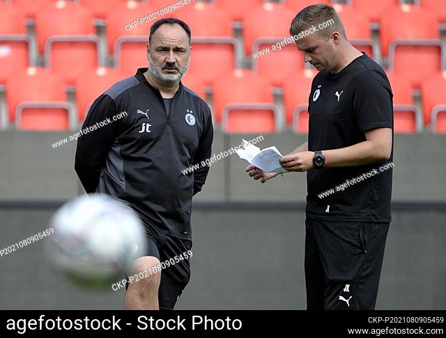 From left head coach of Slavia Jindrich Trpisovsky, Jaroslav Kostl, his assistant in action during the training session prior to Football Champions League 3rd...