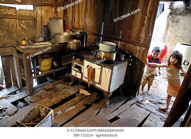 Kitchen with rotten floor in, Encarnacion, Paraguay. The nearby dam Yacyreta at the Rio Parana causes frequent floods