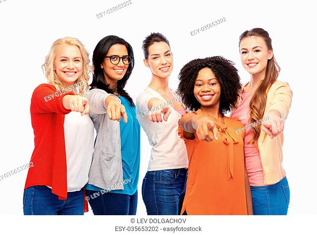 diversity, race, ethnicity and people concept - international group of happy smiling different women over white pointing finger at you