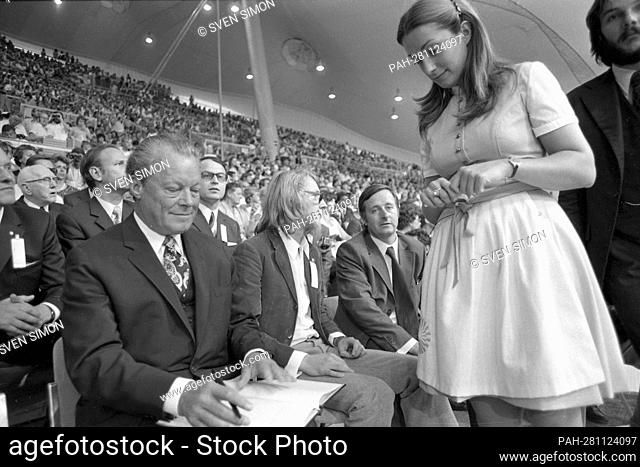 Federal Chancellor Willy BRANDT writes an autograph for an Olympic hostess, from left: Willy BRANDT, SPD, politician, Federal Chancellor, his son Lars BRANDT