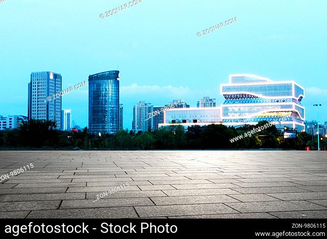 modern landmark buildings from empty brick floor in nanjing